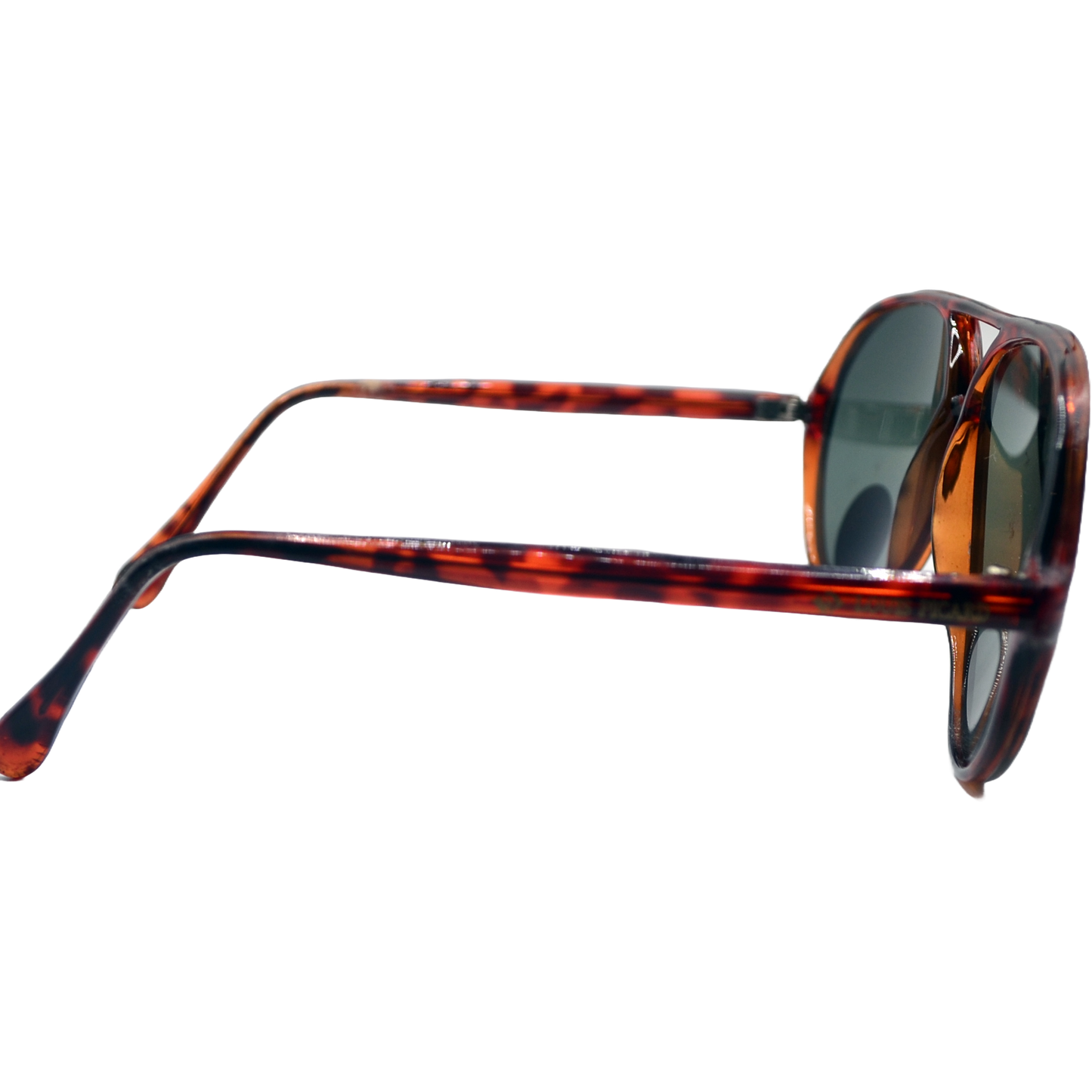 Close-up side view of brown tortoiseshell sunglasses with green lenses. The image highlights the curved temples and the rich, patterned design of the frames, showcasing the sunglasses' classic and stylish appearance.