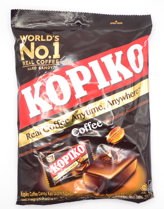 Front view of a 350g bag of Kopiko Coffee Hard Candy, featuring bold red and gold branding with the slogan 'Real Coffee Anytime, Anywhere'. The packaging highlights real coffee extract from Indonesia's volcanic coffee beans, with an image of a coffee-infused hard candy and a coffee bean dissolving into it.